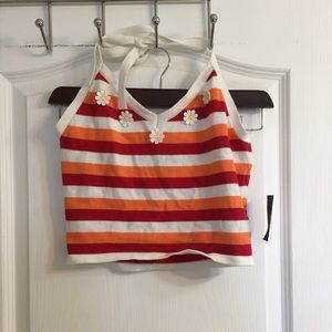 A cropped red, white and orange top with flowers